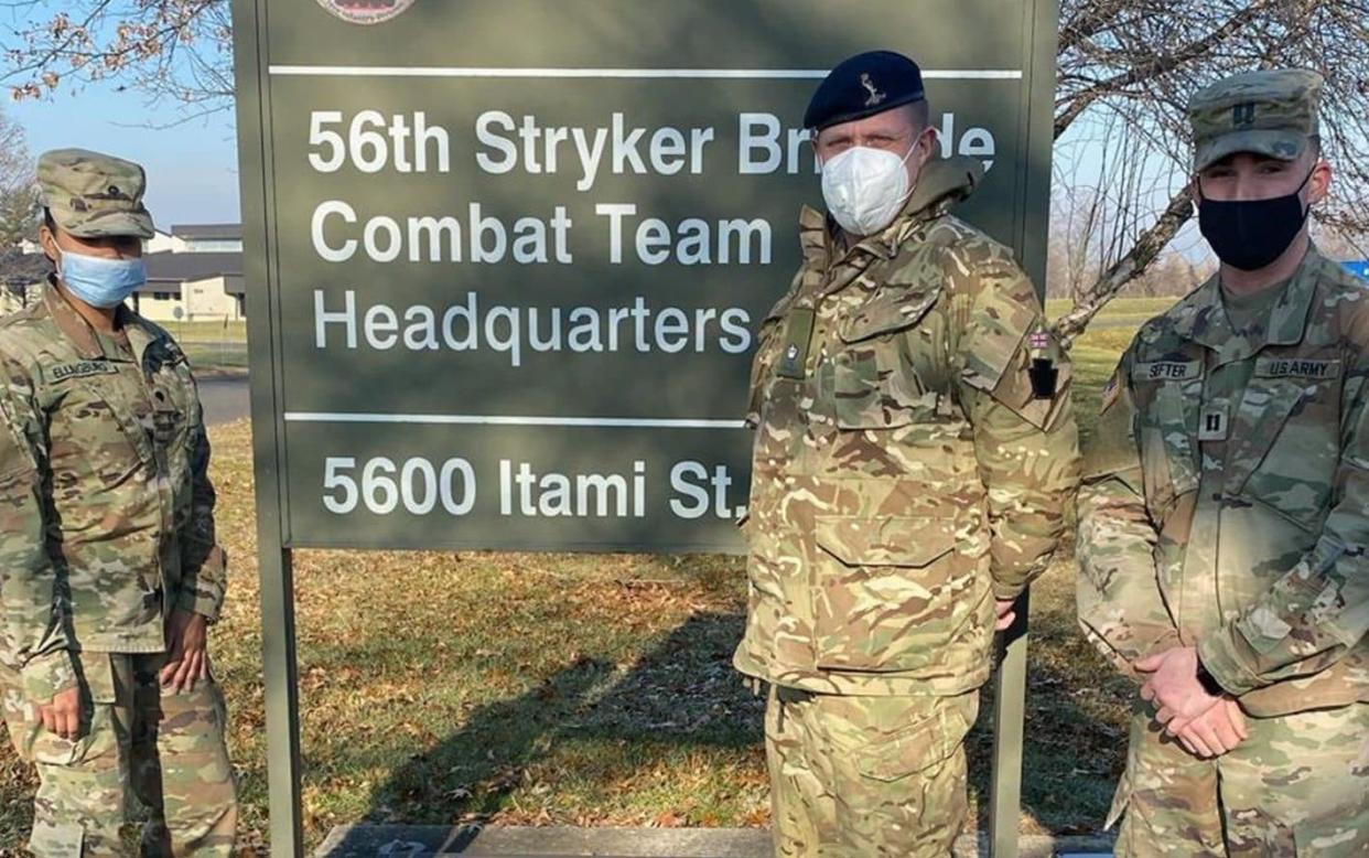 British Army Reservist Major Keiron Francis (centre) with colleagues in the US National Guard. - MoD