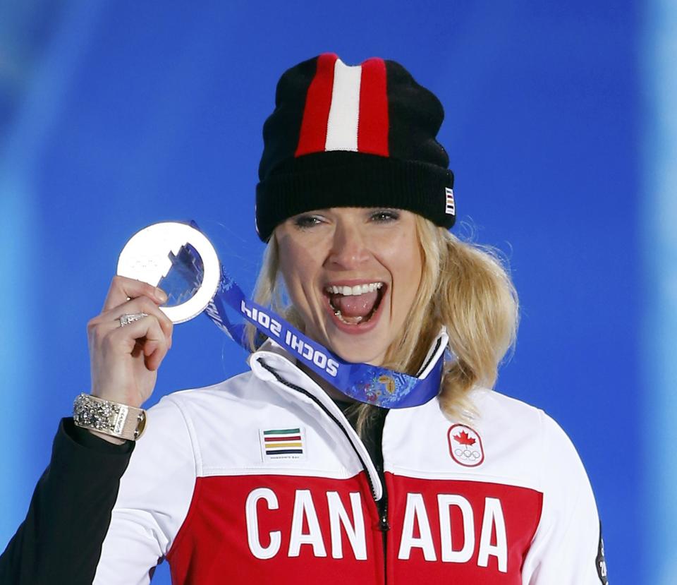 Silver medallist Canada's Dominique Maltais poses during the victory ceremony for the women's snowboard cross competition at the 2014 Sochi Winter Olympics February 16, 2014. REUTERS/Shamil Zhumatov (RUSSIA - Tags: OLYMPICS SPORT SNOWBOARDING TPX IMAGES OF THE DAY)