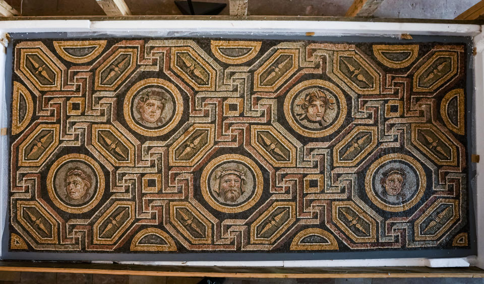 A polychrome mosaic part of 750 archaeological finds from clandestine excavations on Italian territory is on display during a press conference in Rome, Wednesday, May 31, 2023. The set of artifacts, which can be dated overall between the eighth century BC. and the medieval period, and whose value is estimated at 12 million euros, was in possession of an English company in liquidation, Symes Ltd, attributable to Robin Symes, an important trafficker of cultural assets, and was repatriated from London on 19 May. (AP Photo/Domenico Stinellis)