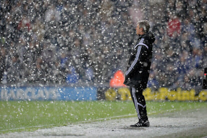 Alan Irvine head coach / manager of West Bromwich Albion watches his team play out a 1-3 defeat in the snow on Boxing Day