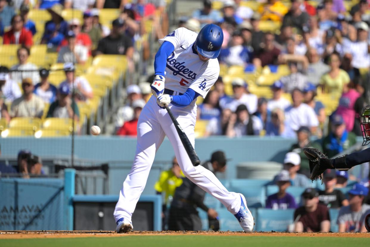 LOS ANGELES, CALIFORNIA - JULY 21: Freddie Freeman #5 of the Los Angeles Dodgers hits a solo home run in the first inning against the Boston Red Sox at Dodger Stadium on July 21, 2024 in Los Angeles, California. (Photo by Jayne Kamin-Oncea/Getty Images)