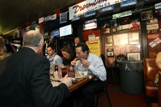 Republican presidential candidate Rick Santorum (R) eats ribs with his wife Karen during a campaign stop March 12, in Tuscaloosa, Alabama. Republican White House hopefuls set their sights on President Barack Obama's home state of Illinois Friday in hopes of shaking up the plodding race to become their party's standard bearer in the November election