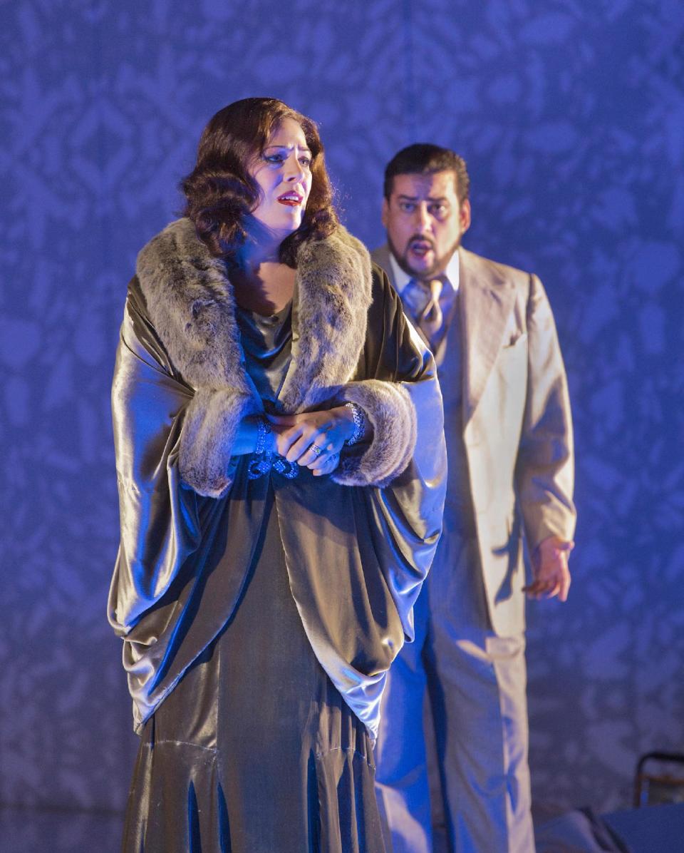 In this Nov. 1, 2012, photo provided by the Metropolitan Opera, Sondra Radvanovsky as Amelia and Marcelo Álvarez as Gustavo III perform during a dress rehearsal of Verdi's “A Masked Ball” at the Metropolitan Opera in New York. (AP Photo/Ken Howard)