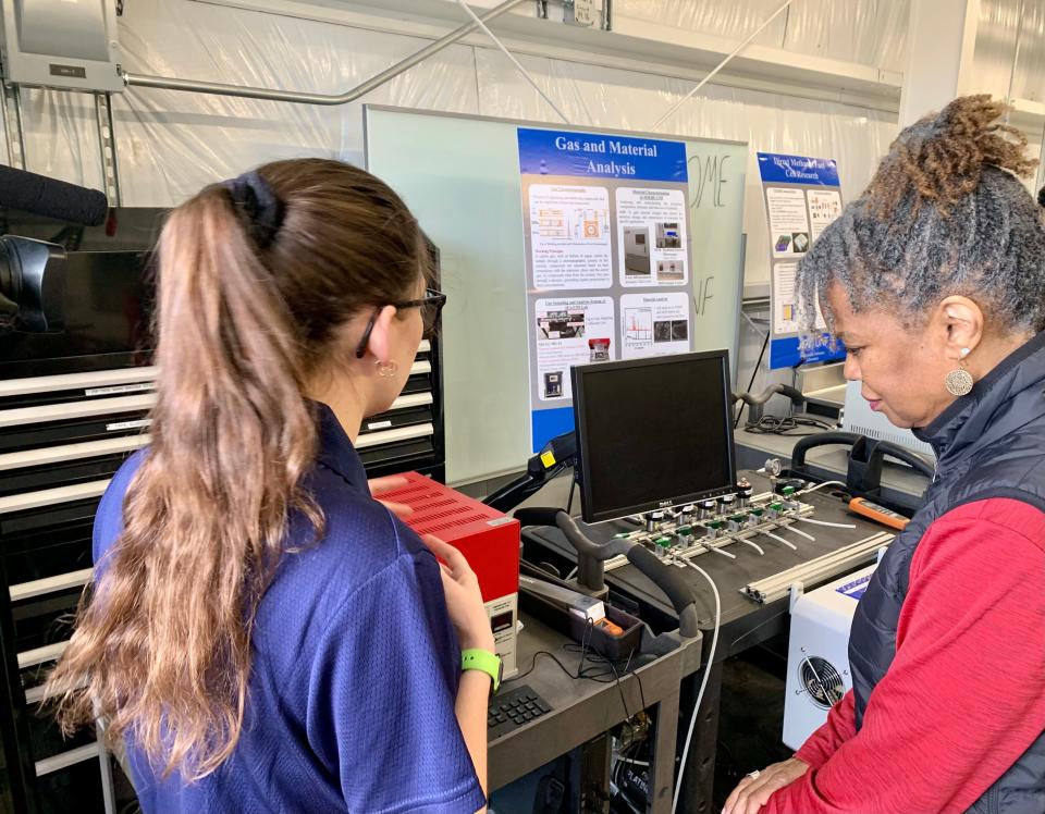 JEA Chief Operating Officer Raynetta Curry Marshall, at right, talks to UNF research student about projects at the JEA Sustainable Solutions Lab on the UNF campus. JEA is providing $500,000 over the next five years to financially support the operation of the lab.