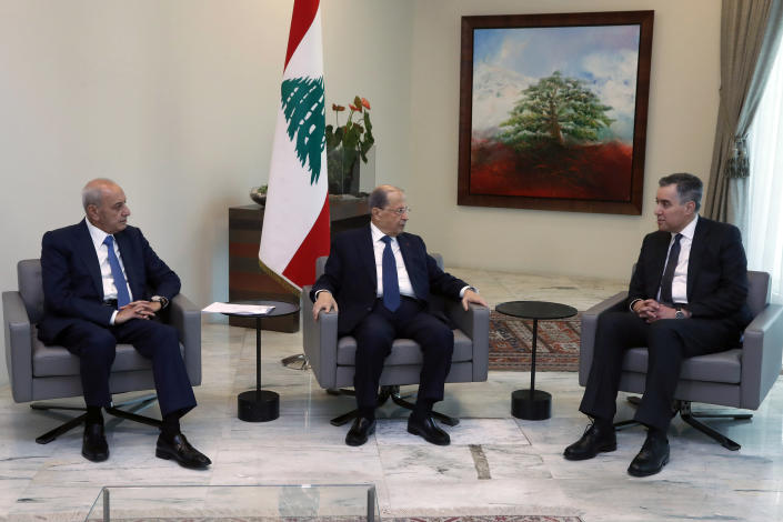 In this photo released by the Lebanese Government, Lebanese President Michel Aoun, center, meets with Prime Minister-Designate Mustapha Adib, right, and Parliament Speaker Nabih Berri, left, at the Presidential Palace in Baabda, east of Beirut, Lebanon, Monday, Aug. 31, 2020. (Dalati Nohra/Lebanese Government via AP)