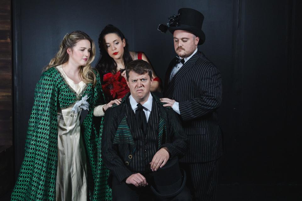 From left: Kate Merryman as Ghost of Christmas Past, Kristen Basore as Ghost of Christmas Present, Jay Rittbeger as Ebenezer Scrooge, Dallas Ray as Ghost of Christmas Future in “Mr. Scrooge the Musical.”