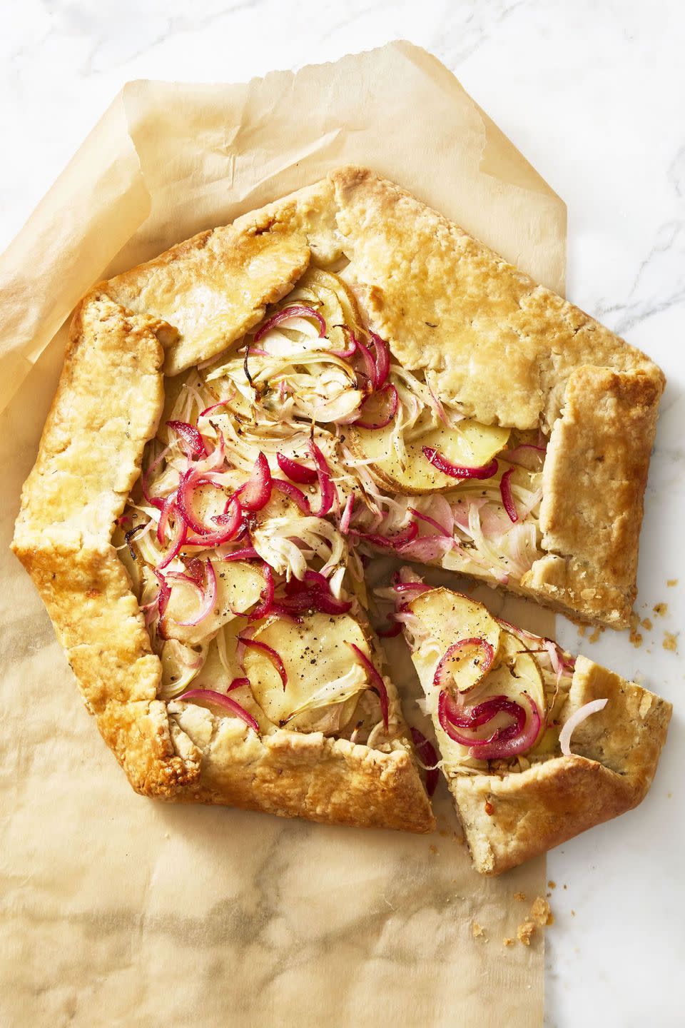 <p>This cheesy, golden galette will warm you right up.</p><p>Get the<strong> <a href="https://www.goodhousekeeping.com/food-recipes/a46637/rustic-potato-and-fennel-galette/" rel="nofollow noopener" target="_blank" data-ylk="slk:Rustic Potato and Fennel Galette recipe" class="link ">Rustic Potato and Fennel Galette recipe</a></strong>.</p>