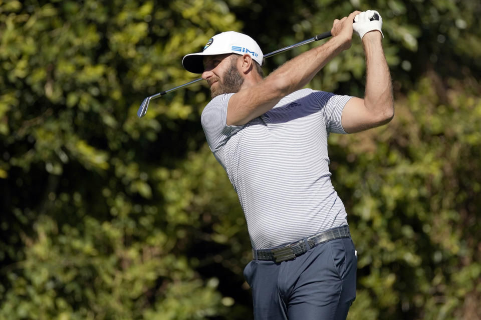 Dustin Johnson tees off on the fourth hole during the final round of the Genesis Invitational golf tournament at Riviera Country Club, Sunday, Feb. 21, 2021, in the Pacific Palisades area of Los Angeles. (AP Photo/Ryan Kang)