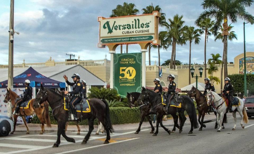 City of Miami Police Mounted Patrol officers ride front of Versailles restaurant in Little Havana in 2021.