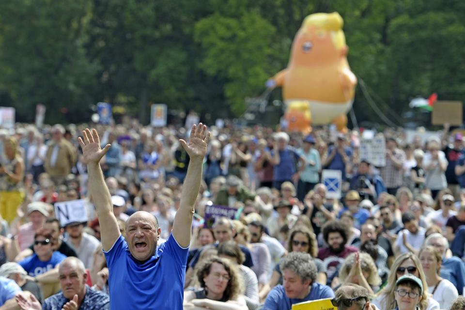 <p>A giant balloon depicting President Trump as an orange baby is launched as protesters gather in the Meadows after taking part in the Scotland United Against Trump march through the streets of Edinburgh, Scotland, on July 14, 2018, on the third day of Trump’s four-day U.K. visit. (Photo: Nwil Hanna/AFP/Getty Images) </p>