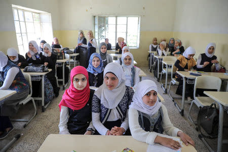 Pupils attend a class at an elementary school in eastern Mosul, Iraq, April 17, 2017. REUTERS/Marko Djurica TPX IMAGES OF THE DAY