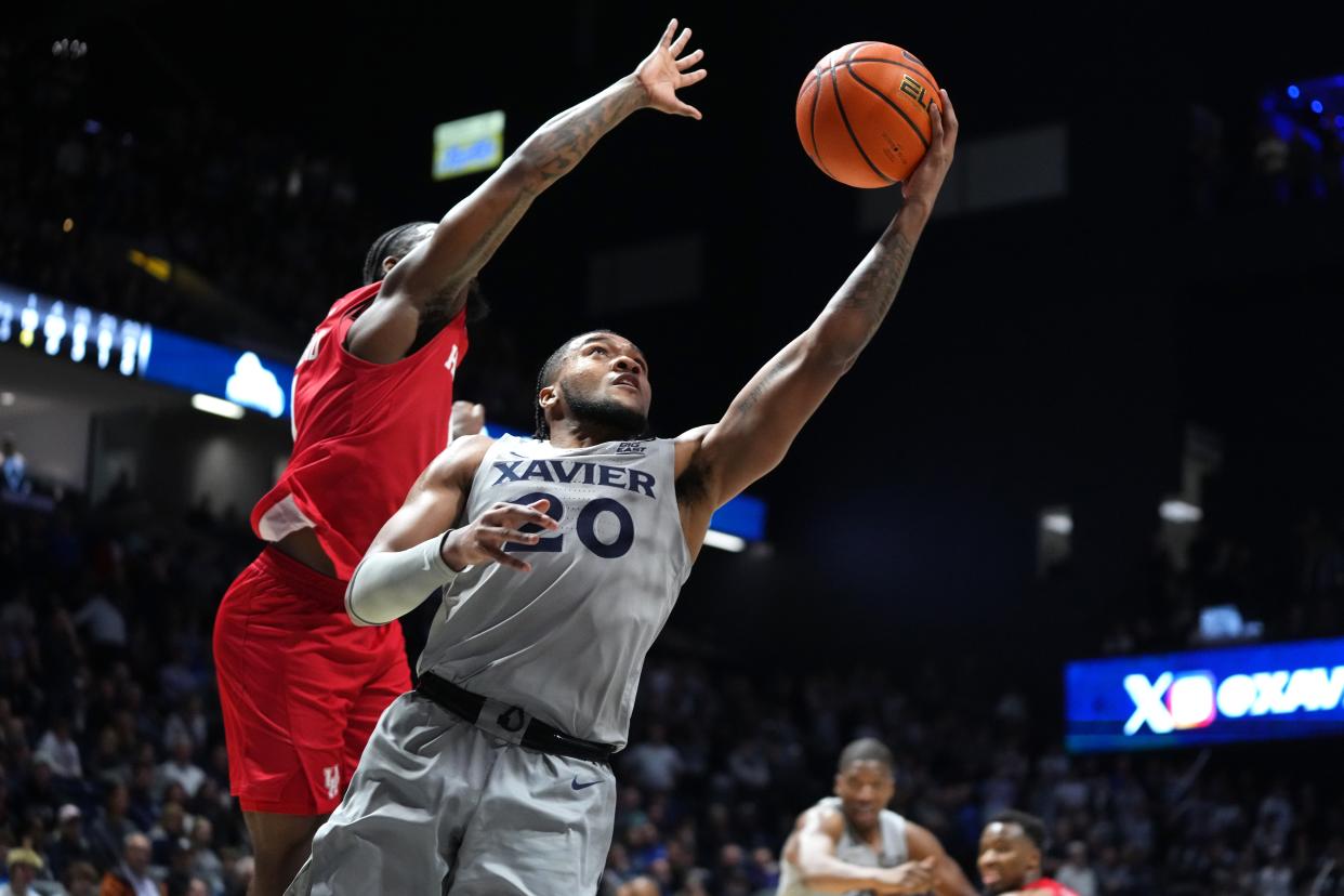 Xavier guard Dayvion McKnight (20) drives to the rim against Houston in the Big East-Big 12 Battle on Dec. 1, 2023 at Cintas Center in Cincinnati. Xavier lost, 66-60.