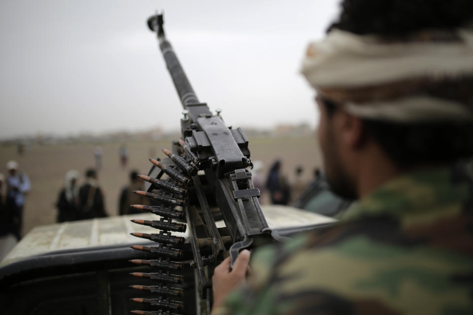 FILE - In this Aug. 1, 2019 file photo, a Houthi fighter holds a weapon during a gathering aimed at mobilizing more fighters for the Houthi movement, in Sanaa, Yemen. Houthi rebels in Yemen have blocked half of the United Nations’ aid delivery programs in the war-torn country — a strong-arm tactic to force the agency to give them greater control over the massive humanitarian campaign, along with a cut of billions of dollars in foreign assistance, according to aid officials and internal documents obtained by The Associated Press. (AP Photo/Hani Mohammed, File)