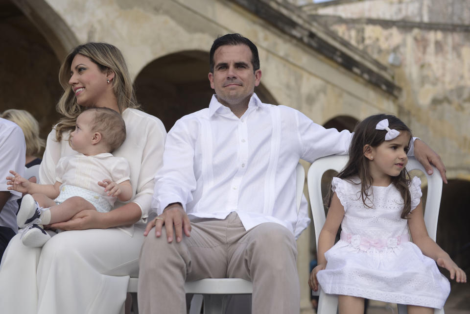 Puerto Rico Governor Ricardo Rossello sits with his wife Beatriz and kids, Pedro Javier and Claudia during a remembrance ceremony convened by Governor Ricardo Rossello at the San Cristobal Castle, on the anniversary of Hurricane Maria, in San Juan, Puerto Rico, Thursday, September 20, 2018. Hurricane Maria left almost three thousand dead, caused economic losses amounting hundreds of millions of dollars and left a path of destruction and damaged infrastructure through the island. (AP Photo Carlos Giusti)