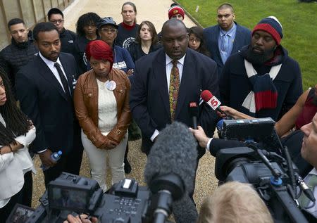 The mother Lesley McSpadden (2nd L) and father Michael Brown Sr. (R) of slain teenager Michael Brown, address the media with their lawyer lawyer Darryl Parks (2nd R) after a news conference in Geneva November 12, 2014. REUTERS/Denis Balibouse