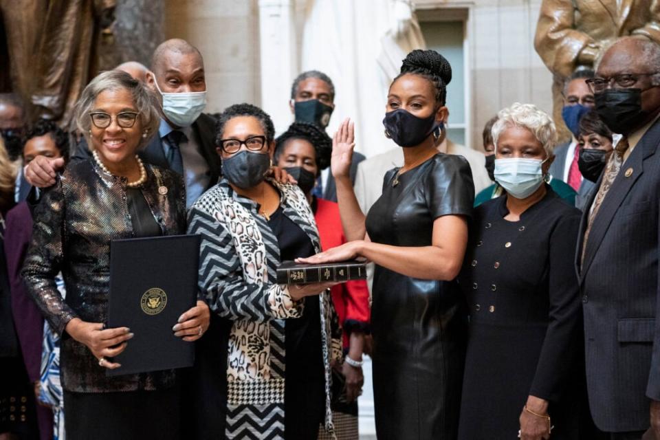 Representative-elect Shontel Brown (D-Ohio) participates in a swearing-in ceremony with Marcia Fudge, Secretary of Housing and Urban Development (2nd L) to the Congressional Black Caucus in Statuary Hall at the U.S. Capitol on November 4, 2021 in Washington, DC. (Photo by Sarah Silbiger/Getty Images)