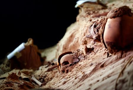 Skulls buried in the sand inside a newly discovered burial site in Minya, Egypt May 13, 2017. REUTERS/Mohamed Abd El Ghany