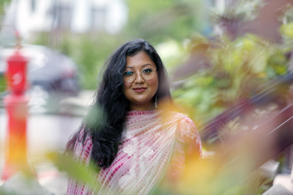 Shahana Hanif, a community organizer strongly favored to win a seat on the New York City Council in the upcoming municipal election, stands in front of her home in the Kensington neighborhood of the Brooklyn borough of New York, on Wednesday, Aug. 18, 2021. In 2001, mere weeks after the twin towers at the World Trade Center fell, car passed, the driver’s window rolled down and the man spat an epithet at two little girls wearing their hijabs: “Terrorist!” as a 10-year-old Shahana and her younger sister were walking to the local mosque from their Brooklyn home. Unsure, afraid, the girls ran. (AP Photo/Emily Leshner)