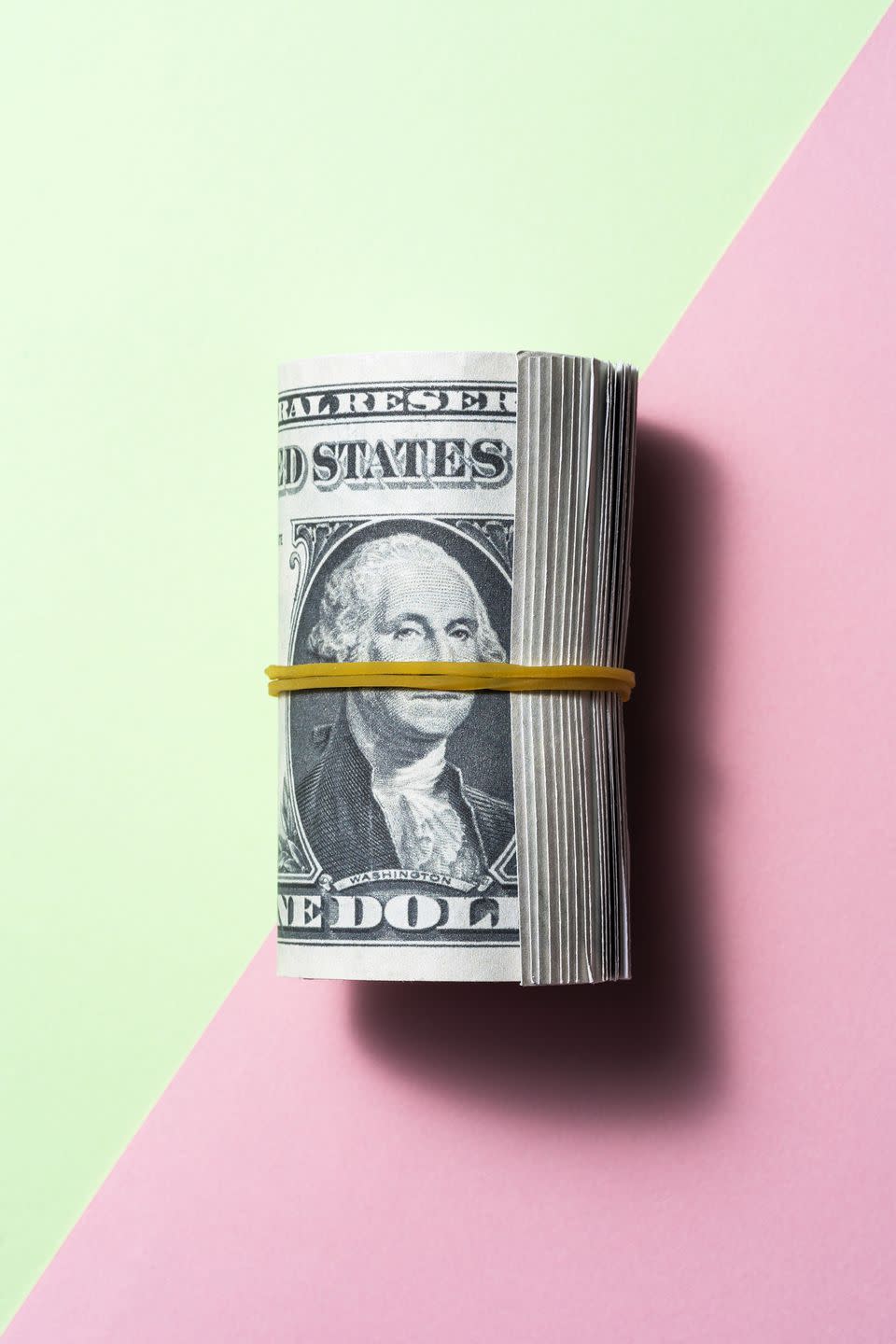 dollar roll on two tone color background