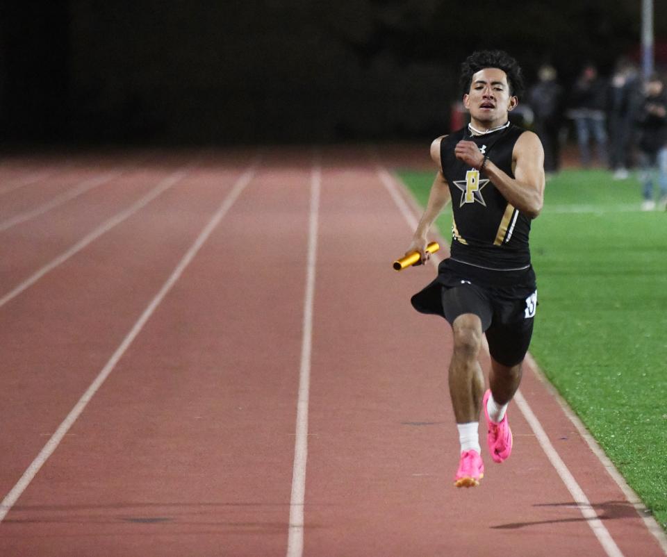 Plains' Jhoan Menjivar finishes the boys 1,600-meter relay at the District 5-2A track meet Thursday, April 6, 2023, at Slaughter Field in Sundown.