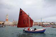 Scores of boats take to the Saint Mark's Basin, as Venetians protest against the damage caused by big ships, in Venice