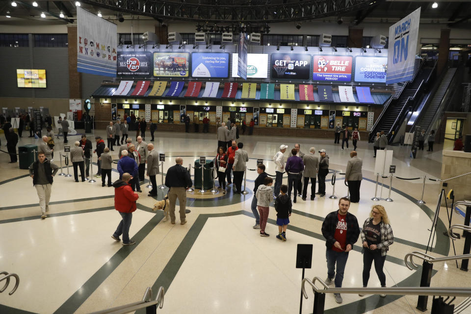 Fans arrive during the second half of an NCAA college basketball game between Northwestern and Minnesota at the Big Ten Conference tournament, Wednesday, March 11, 2020, in Indianapolis. Minnesota won 74-57. (AP Photo/Darron Cummings)