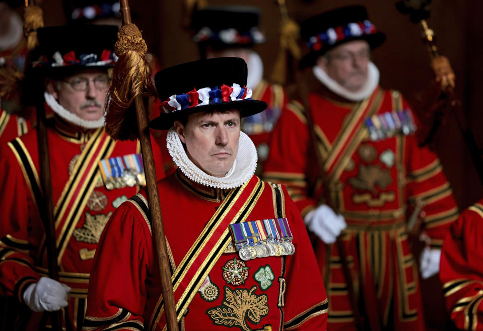 Yeomen of the Guard parade through the Sovereign's entrance ahead of the State Opening of Parliament at Houses of Parliament, in London, Tuesday, May 10, 2022. Britain’s Parliament opens a new year-long session on Tuesday with a mix of royal pomp and raw politics, as Prime Minister Boris Johnson tries to re-energize his scandal-tarnished administration and revive the economy amid a worsening cost-of-living crisis. (Chris Jackson/Pool Photo via AP)