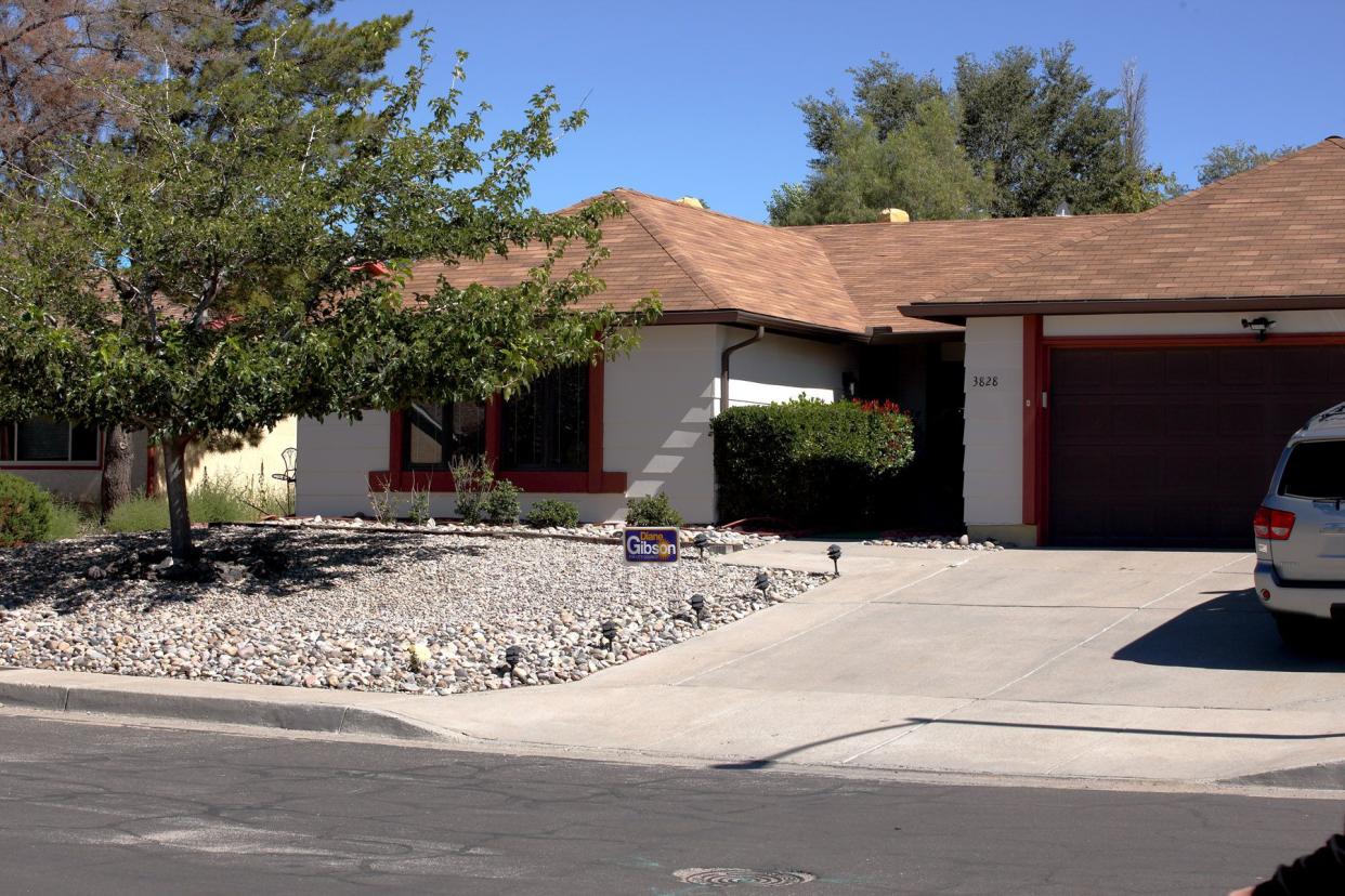 White ranch with brown roof and gravel front yard, home used in the show Breaking Bad.