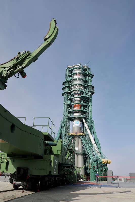 FILE PHOTO: A Soyuz rocket with satellites of British firm OneWeb is removed from a launchpad at the Baikonur Cosmodrome