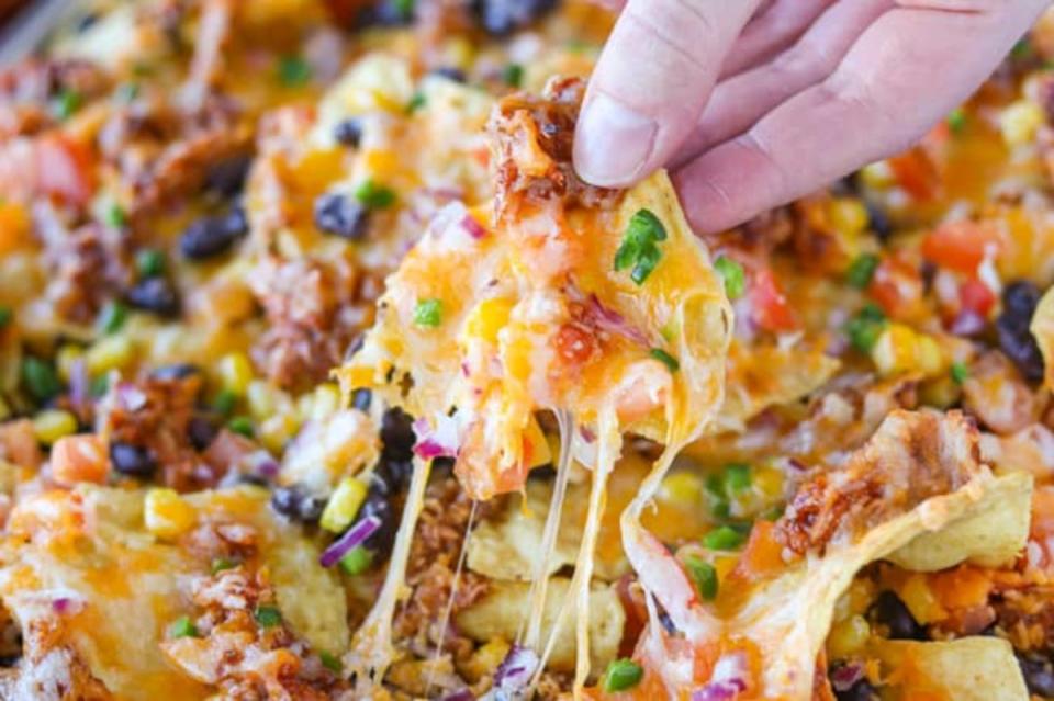 <p>365 Days of Baking and More</p><p>Nachos are perfect for game day or as an appetizer to share with family and friends. </p><p><strong>Get the Recipe: <a href="https://www.365daysofbakingandmore.com/day-187-chicken-nachos-and-in-the-kitchen-zone" rel="nofollow noopener" target="_blank" data-ylk="slk:Loaded BBQ Chicken Nachos;elm:context_link;itc:0;sec:content-canvas" class="link ">Loaded BBQ Chicken Nachos</a></strong></p>