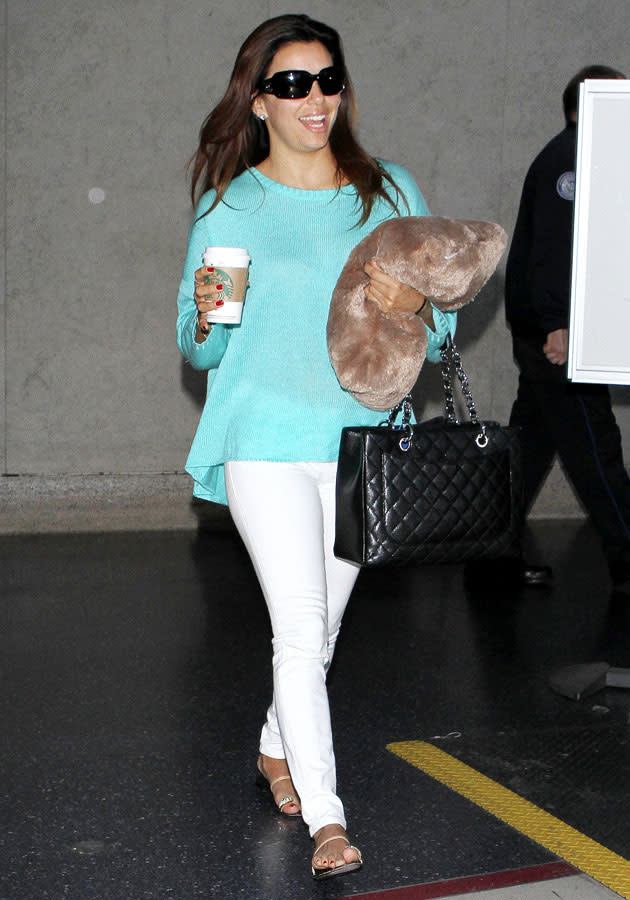 Celebrities in pastel fashion: Eva Longoria styled her turquoise jumper with white jeans. <br><br>[Rex]