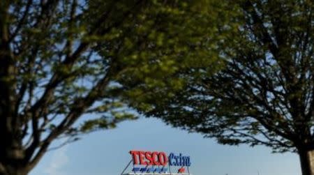 A sign is seen on the roof of a Tesco supermarket in Altrincham, northern England, April 22, 2015. REUTERS/Phil Noble