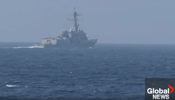 PHOTO: A Chinese warship appears to have intercepted the pair of U.S. and Canadian ships transiting through the Taiwan Strait overnight. (Global News)