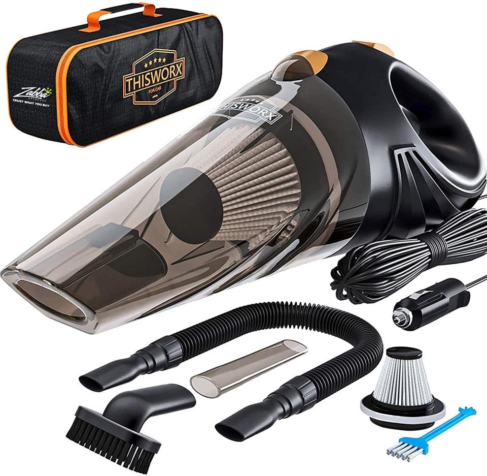 A car vacuum kit that includes a handheld vacuum, a storage bag, and various attachments, plugs, and filters 