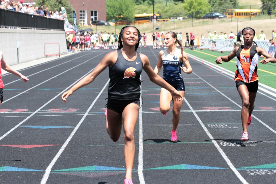 Keyanna O'Tey crossed the finish line after winning the 100 dash on Saturday in the D2 state finals.