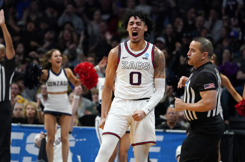 Gonzaga guard Julian Strawther reacts after hitting a 3-point basket in the second half of a second-round college basketball game against TCU in the men's NCAA tournament Saturday, March 19, 2023, in Denver. (AP Photo/John Leyba)