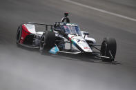 Takuma Sato, of Japan, drives into Turn 2 during qualifying for the Indianapolis 500 auto race at Indianapolis Motor Speedway in Indianapolis, Sunday, May 19, 2024. (AP Photo/Michael Conroy)