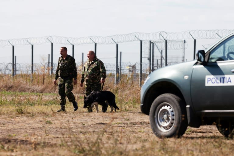 Policemen patrol the border area at Triplex Confinium, where the borders of Romania, Hungary and Serbia meet