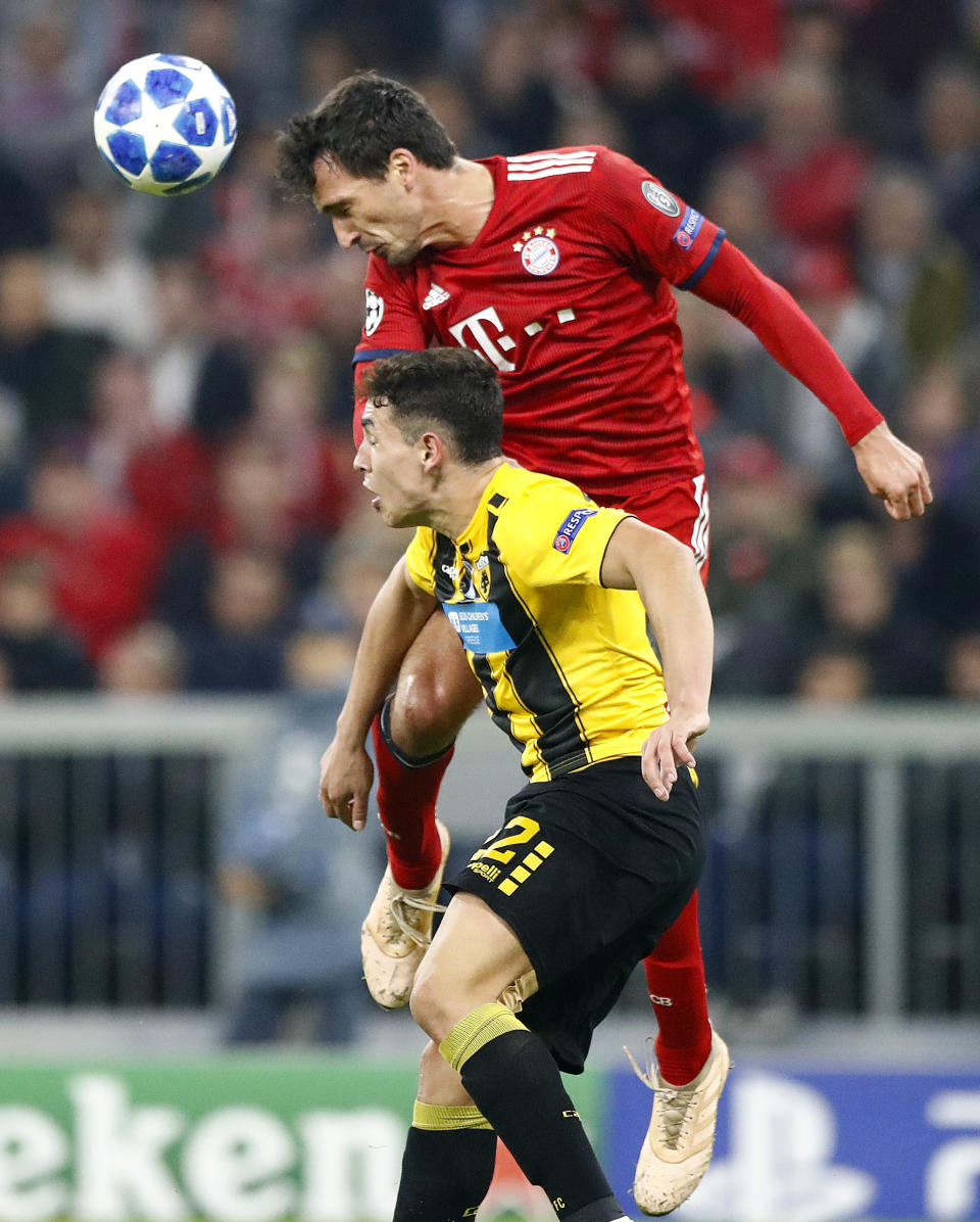 Bayern defender Mats Hummels, top, and AEK's Niklas Hult fight for the ball during the Champions League group E soccer match between FC Bayern Munich and AEK Athen in Munich, Germany, Wednesday, Nov. 7, 2018. (AP Photo/Matthias Schrader)