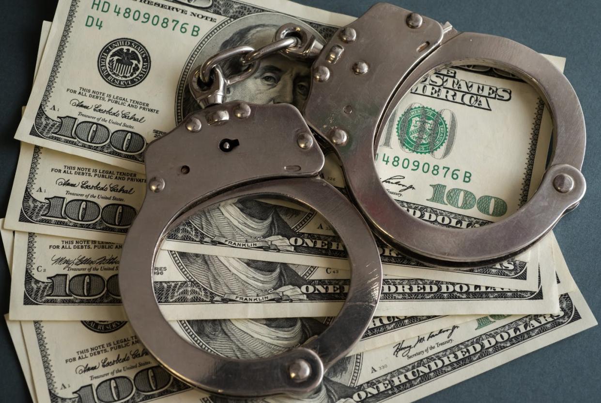 <span class="caption">These funds help people stay out of jail while awaiting trial.</span> <span class="attribution"><a class="link " href="https://www.gettyimages.com/detail/news-photo/in-this-photo-illustrations-handcuffs-and-hundred-us-dollar-news-photo/1230511420?adppopup=true" rel="nofollow noopener" target="_blank" data-ylk="slk:SOPA Images/LightRocket via Getty Images;elm:context_link;itc:0;sec:content-canvas">SOPA Images/LightRocket via Getty Images</a></span>