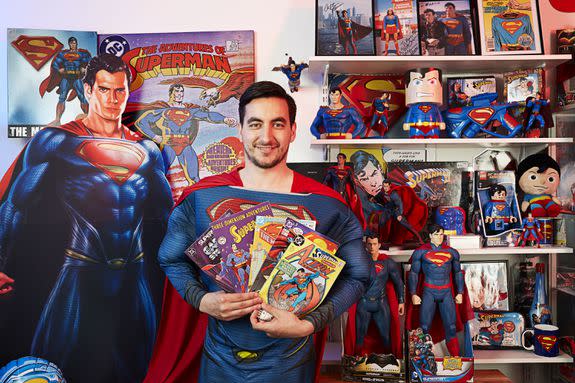 Marco Zorzin shows off his Superman comics.