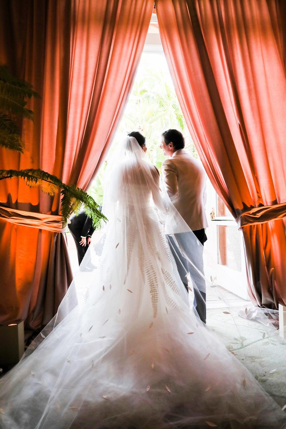 The bride wore Oscar de la Renta, inspired by her grandmother, for her greenery-filled ceremony at the Beverly Hills Hotel.