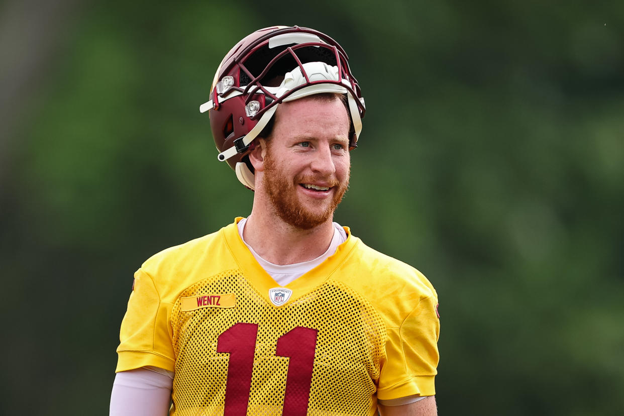 ASHBURN, VA - JUNE 08: Carson Wentz #11 of the Washington Commanders reacts during the organized team activity at INOVA Sports Performance Center on June 8, 2022 in Ashburn, Virginia. (Photo by Scott Taetsch/Getty Images)