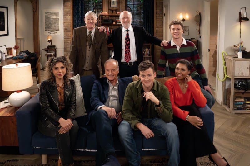 Left to right, Jess Salguiero, Nicholas Lyndhurst, Kelsey Grammer, director James Burrows, Jack Cutmore-Scott, Anders Keith and Toks Olagundoye sit on the new "Frasier" set. Photo courtesy of Paramount+ and CBS Studios