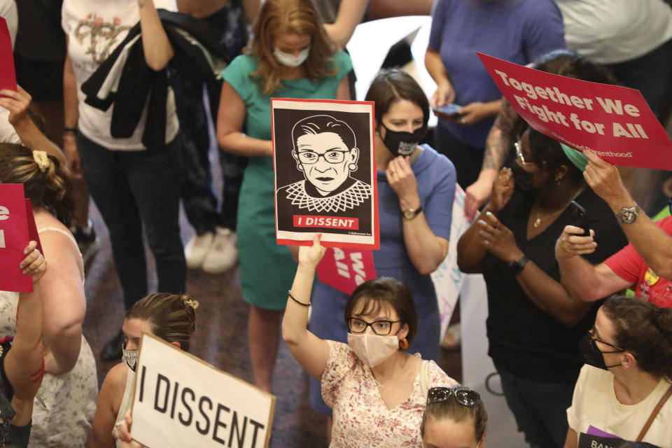 Protesters upset at the recent U.S. Supreme Court ruling removing protections for abortions demonstrate in the lobby of the South Carolina Statehouse on Tuesday, June 28, 2022, in Columbia, S.C. (AP Photo/Jeffrey Collins)