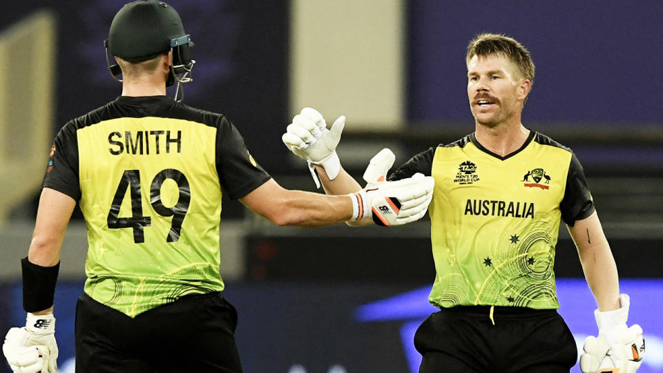 David Warner, pictured here celebrating with Steve Smith after bringing up his half-century.