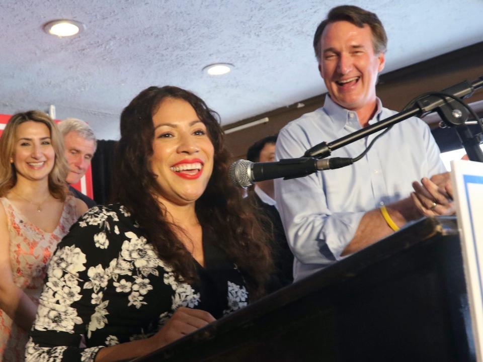 Winner of Tuesday's Republican primary for the 7th district congressional race, Yesli Vega, left, speaks to the crows along with Virginia Gov. Glenn Youngkin at a restaurant Wednesday, June 22, 2022, in Woodbridge, Va.