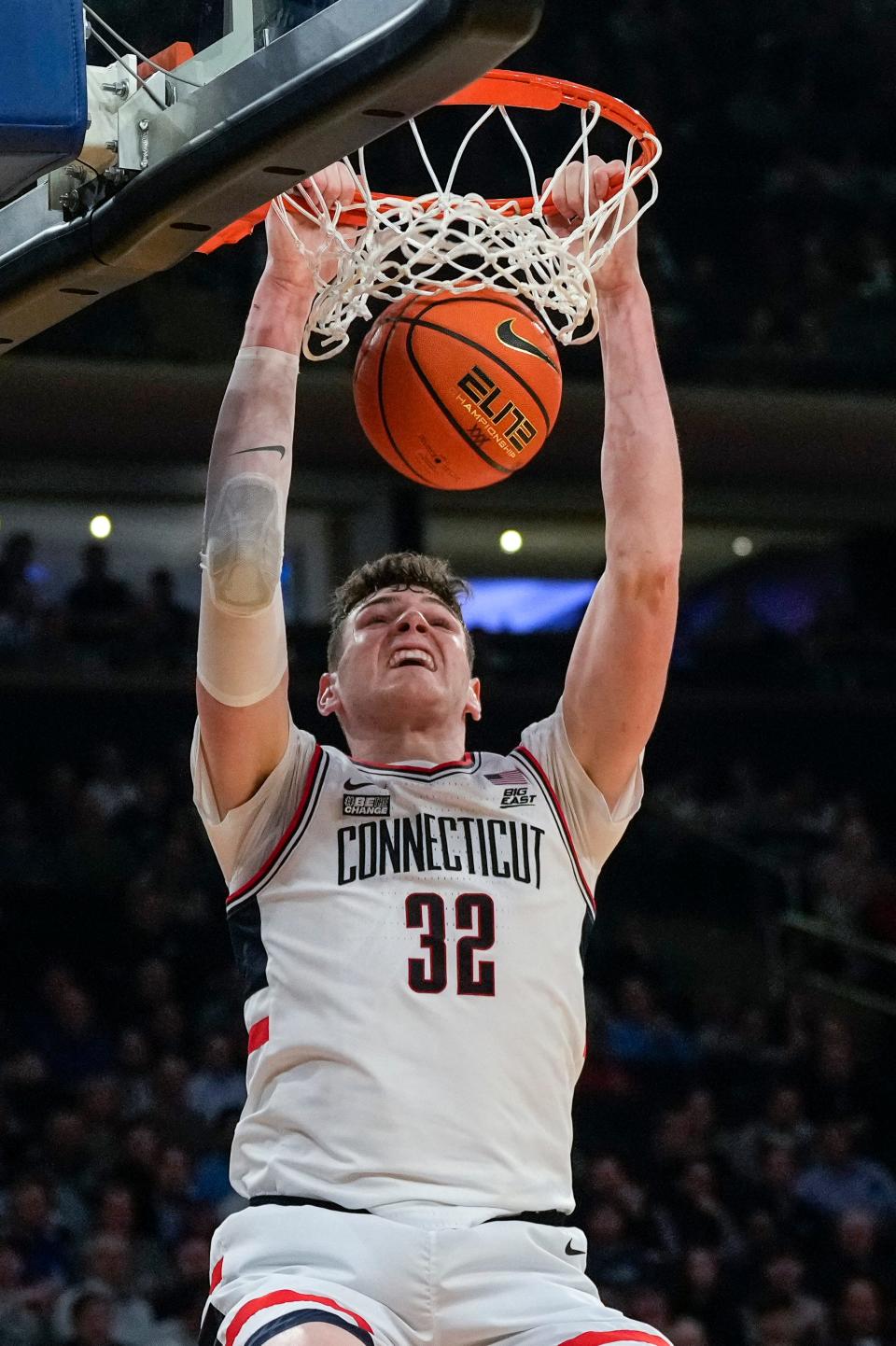 Connecticut Huskies center Donovan Clingan (32) dunks in the second half of the NCAA Big East Conference Tournament second round game between the Connecticut Huskies and the Xavier Musketeers at Madison Square Garden in New York City on Thursday, March 14, 2024. Xavier was eliminated from the tournament by a 87-60 loss to UConn.