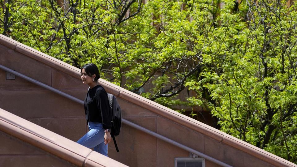 Fahima Sultani walks on campus at Arizona State University, Friday, April 7, 2023, in Tempe, Ariz. (Matt York/AP)