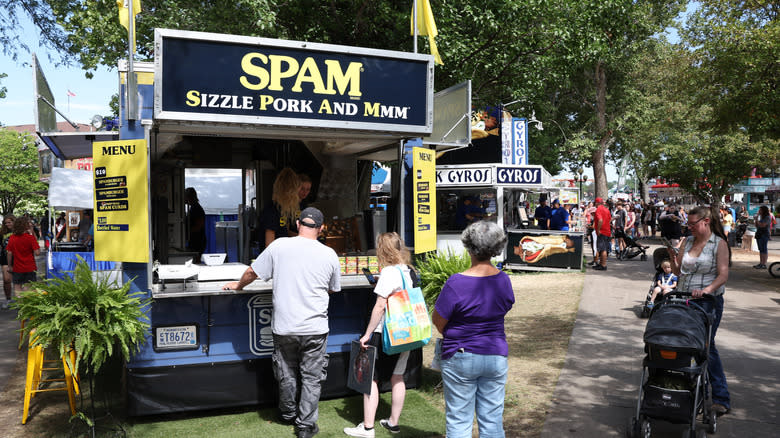 People outside Spam stall